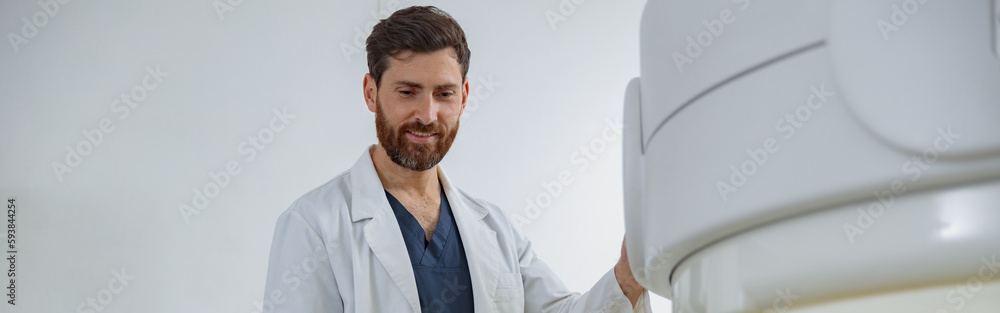 Radiologist controls MRI or CT or PET Scan with female patient undergoing procedure Radiologist controls MRI or CT or PET Scan with female patient undergoing procedure