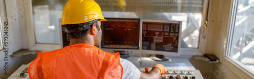 Photos Experienced operator concentrating at his work in plant