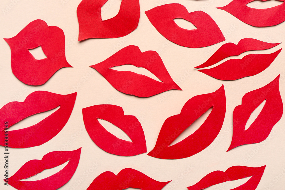 Red paper lips on beige background Red paper lips on beige background