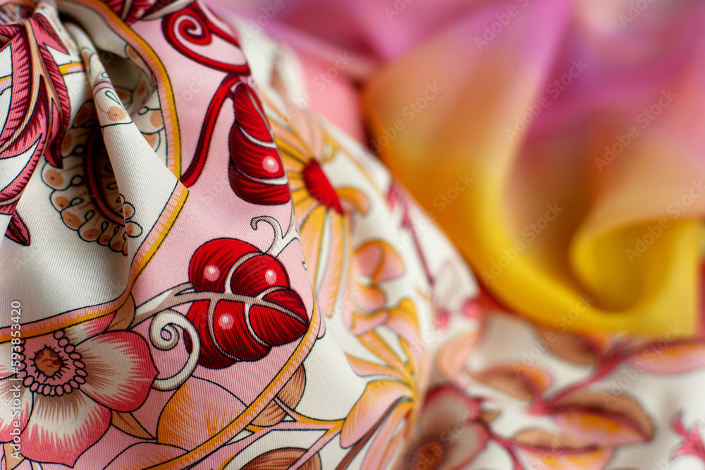 Beautiful bright fabric close-up. Silk delicate fabric for sewing and decoration. Textile and its texture.
