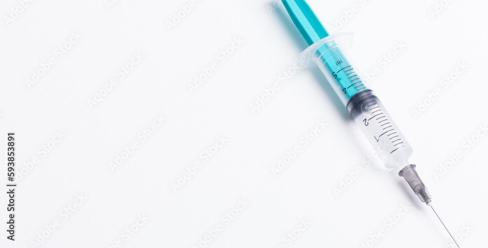Disposable plastic syringe prepared for injection and vaccination in the hospital. The concept of medicine and health Disposable plastic syringe prepared for injection and vaccination in the hospital. The concept of medicine and health