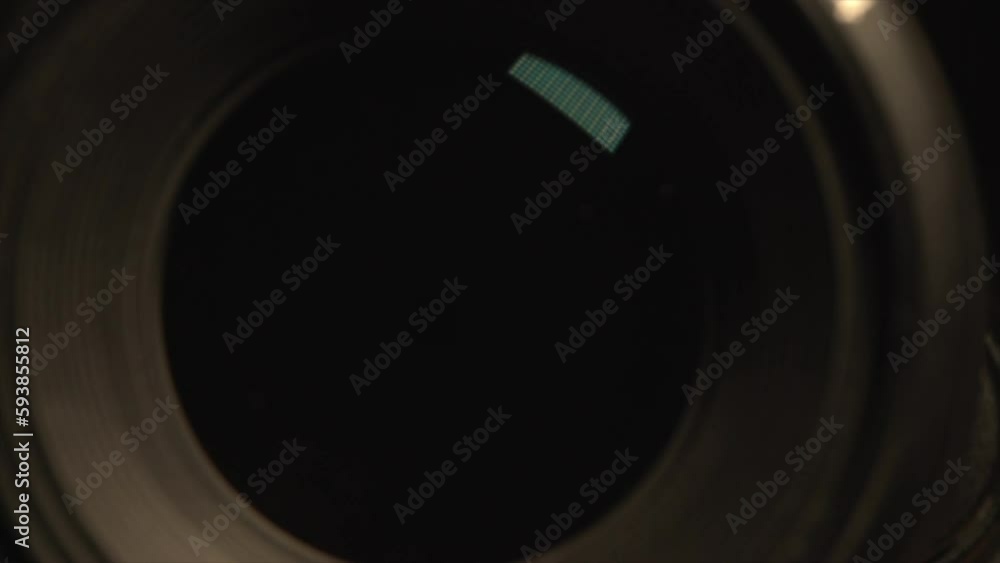 Camera lens, reflection on glass of lens, space of aperture, opening of