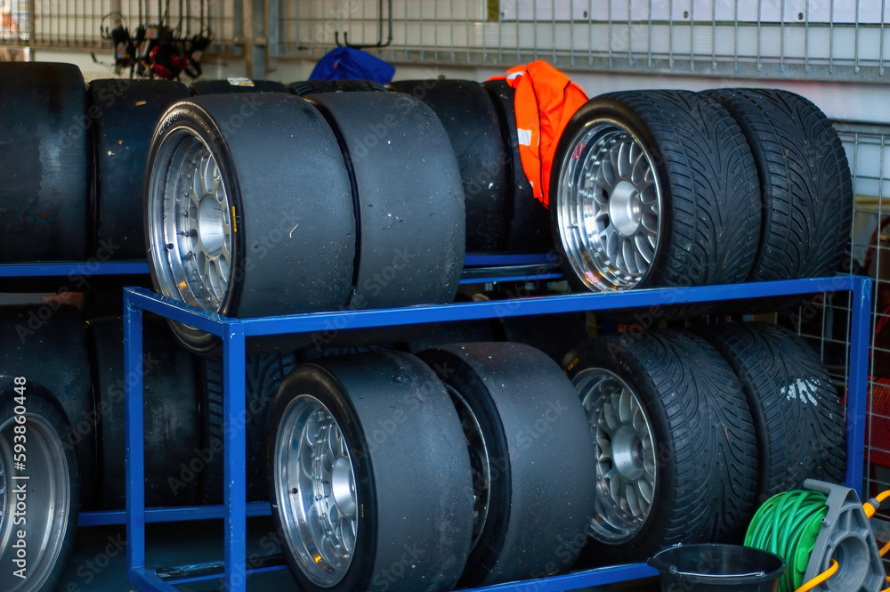 Stack of racing tires prepared in box to be mounted on racing car Stack of racing tires prepared in box to be mounted on racing car