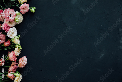 white pink flowers on a black background