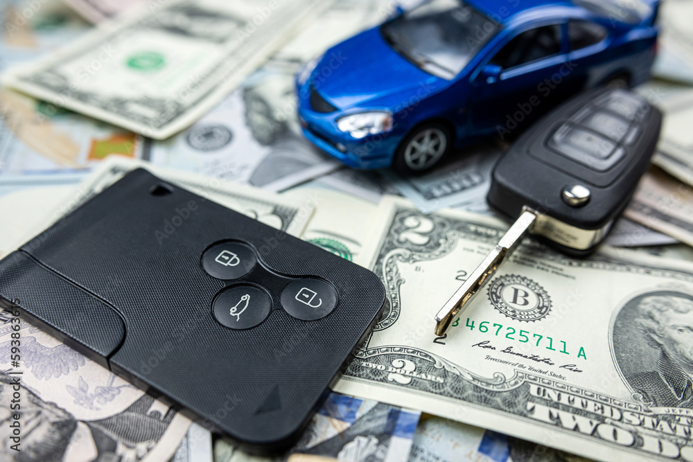 blue toy car with key over us money blue toy car with key over us money