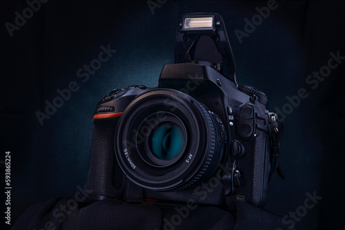 Professional DSLR camera on the black, dark background