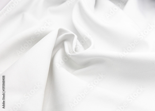 Texture for a background with crumpled and wrinkled white satin cloth, fabric and materials. There is an empty blank space to use as a copy space. the surface and the shadow.