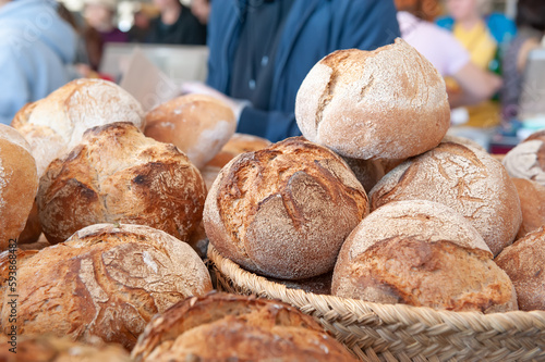 Rye sourdough bread with sunflower seeds on the counter. Bulging round loaves of wholegrain bread from a private bakery. Small business