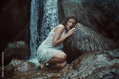 Photos Woman feeling waterfall might