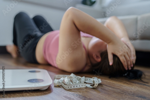 Bilde på lerret Obese Woman with fat upset bored of dieting Weight loss fail  Fat diet and scale