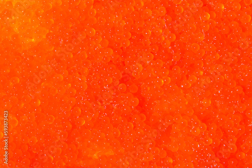 close-up photo of red caviar with many eggs