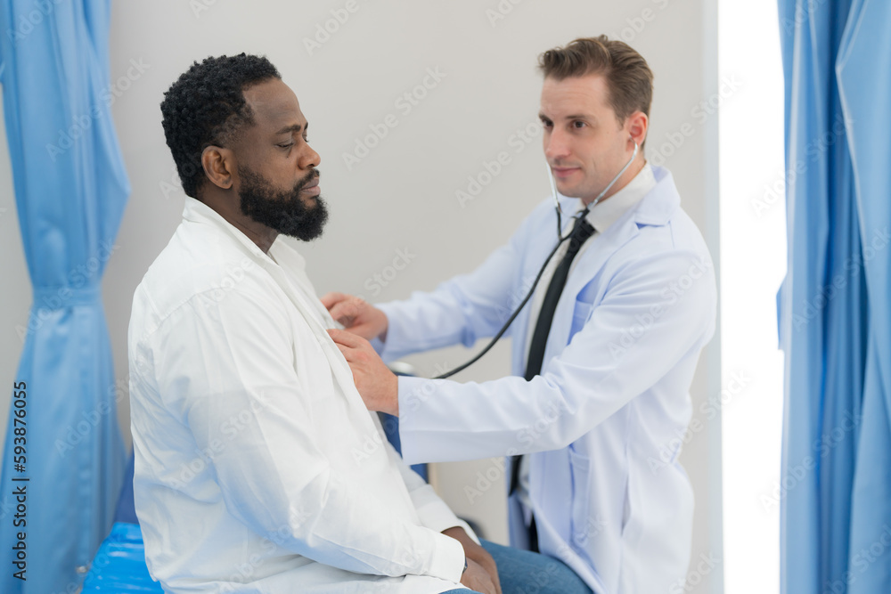 Doctor checking heart rate of male. Doctor checking heart rate of male.