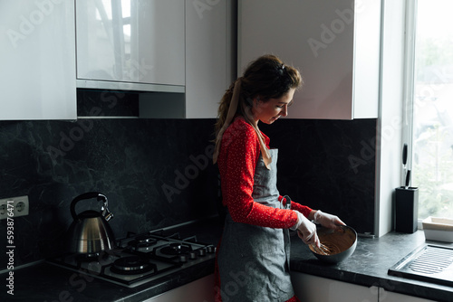 woman cook in the kitchen prepares meals