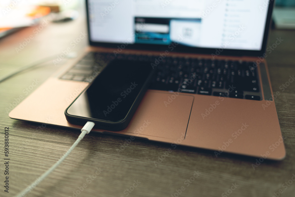 Connect your smartphone to your laptop computer. to transfer data Connect your smartphone to your laptop computer. to transfer data