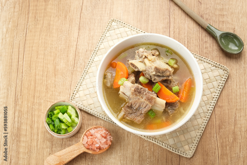 Sop Iga (Beef ribs soup) made from ribs, carrots, leeks. Served in white bowl. Indonesian food
Sop Iga (Beef ribs soup) made from ribs, carrots, leeks. Served in white bowl. Indonesian food