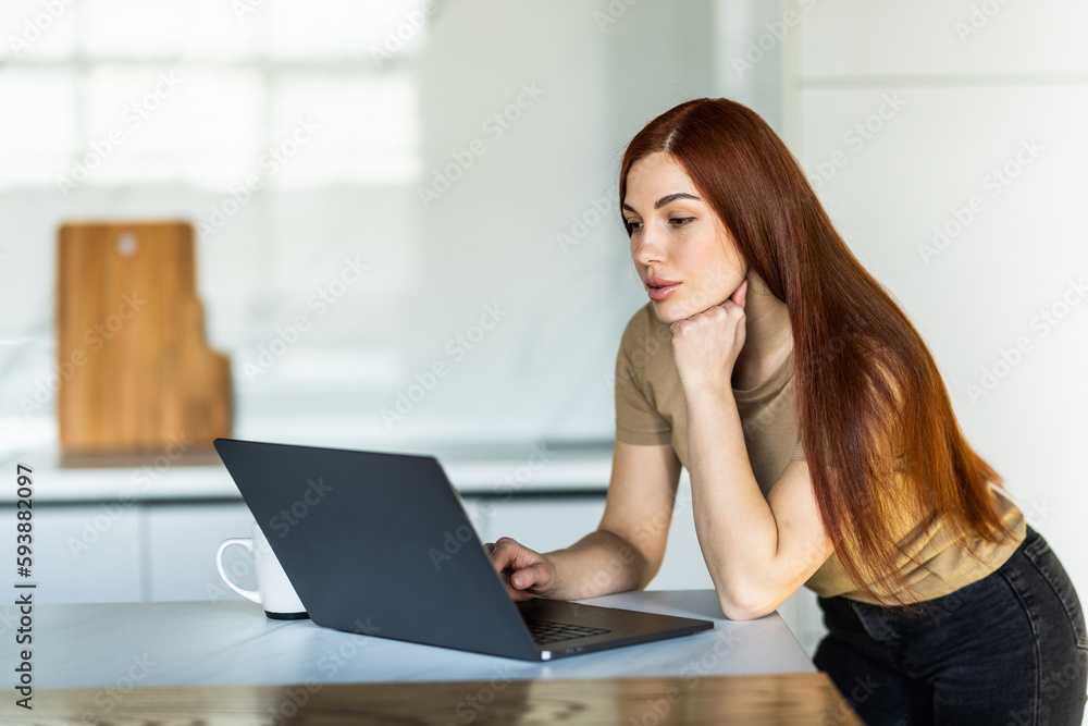 Cute smiling woman using laptop at home. Student girl working on computer. Online shopping, work from home, freelance, online learning, studying, lockdown concept. Distance education Cute smiling woman using laptop at home. Student girl working on computer. Online shopping, work from home, freelance, online learning, studying, lockdown concept. Distance education