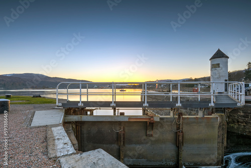 A beautiful sunset over the canal lock at Corpach Basin on Loch Linnhe, east of the narrows leading to Loch Eil. It is the western sea entrance of the Caledonian Canal.