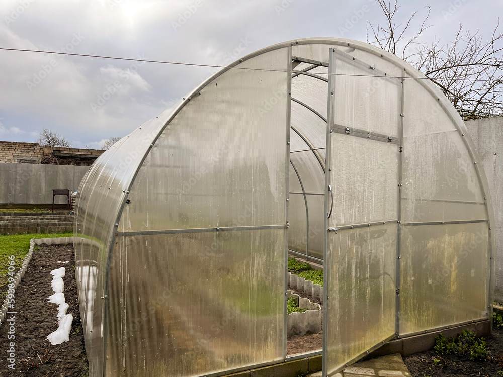 polycarbonate greenhouse is ready for use in early spring in the garden polycarbonate greenhouse is ready for use in early spring in the garden