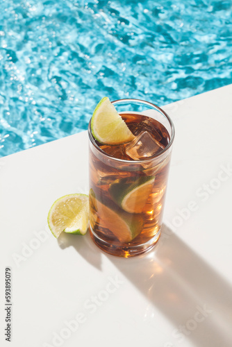 cocktail and lemon in the pool