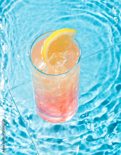 cocktail and lemon near the pool