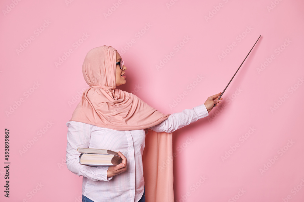 Inspired confident middle aged Arab Muslim woman, a school teacher or ...