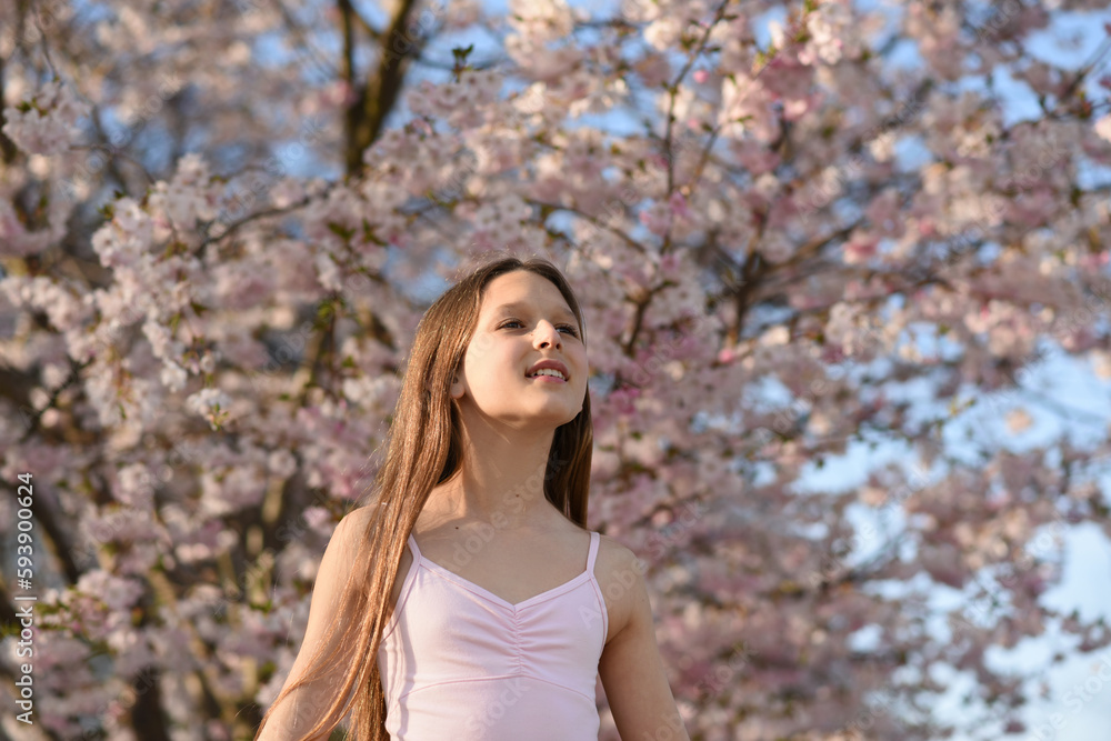 portrait of a woman in the park. Blooming trees portrait of a woman in the park. Blooming trees