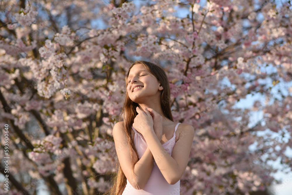 portrait of a woman in the park. Blooming trees portrait of a woman in the park. Blooming trees