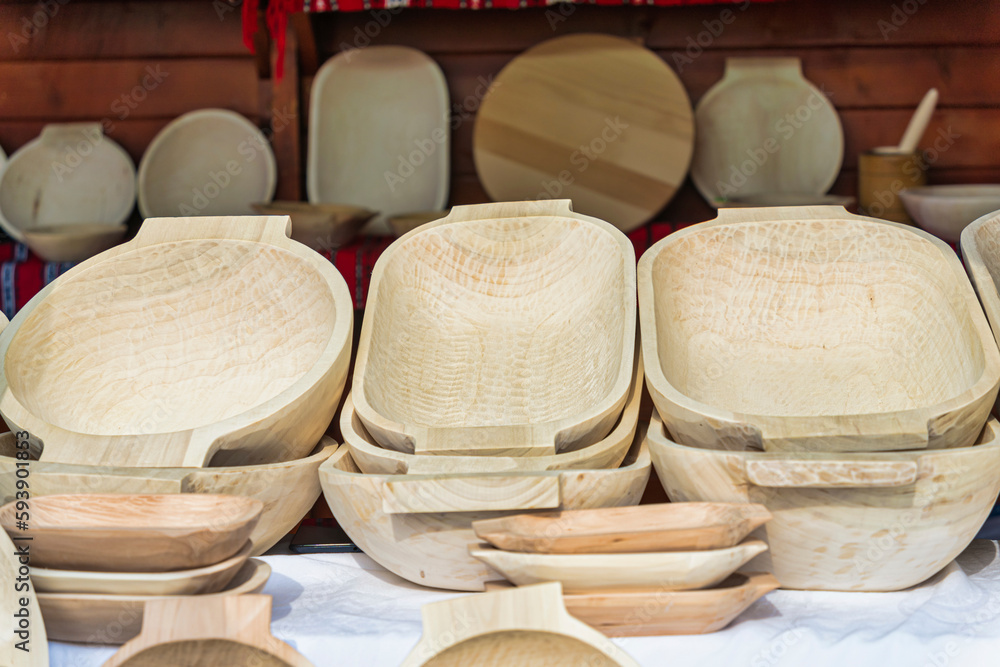 Traditional romanian hand made wooden dishes on display for sale.