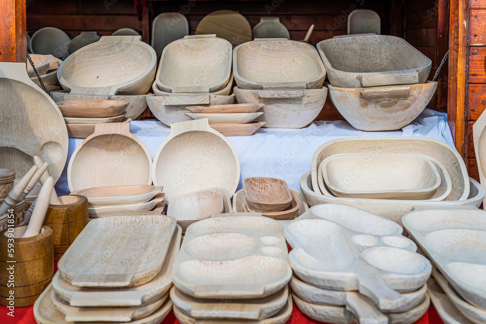 Traditional romanian hand made wooden dishes on display for sale.