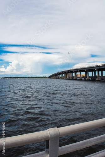 Vertical view of the sea with cloudy sky from a bridge in Bradenton, Florida