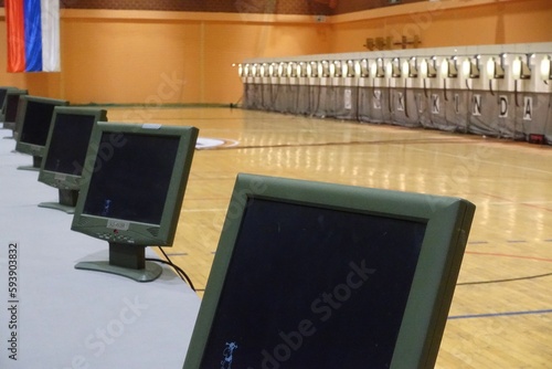 Row of display screens at a shooting range