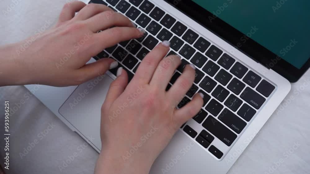 Close-up of woman hands typing on the laptop keyboard. Remote work. Work at home Close-up of woman hands typing on the laptop keyboard. Remote work. Work at home
