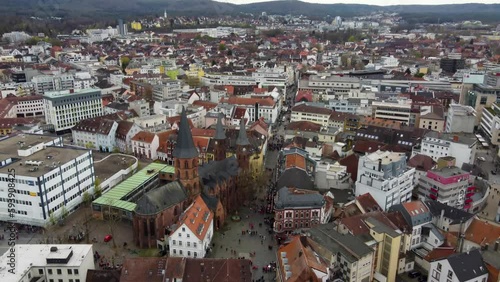 Aerial drone view of old city of Kaiserslautern, Germany while the FCK Kaiserslautern fans (  football match spectators ) crowding at a street intersection celebrating their win ( victory ) with beer photo