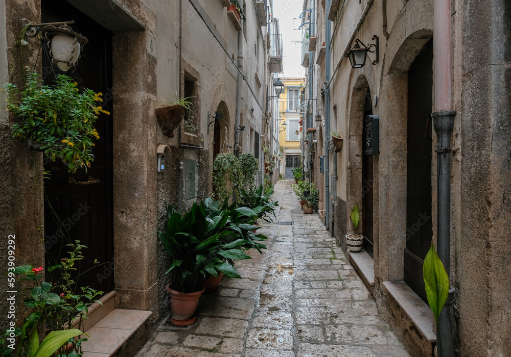 A narrow street among the old houses of Isernia, Italy