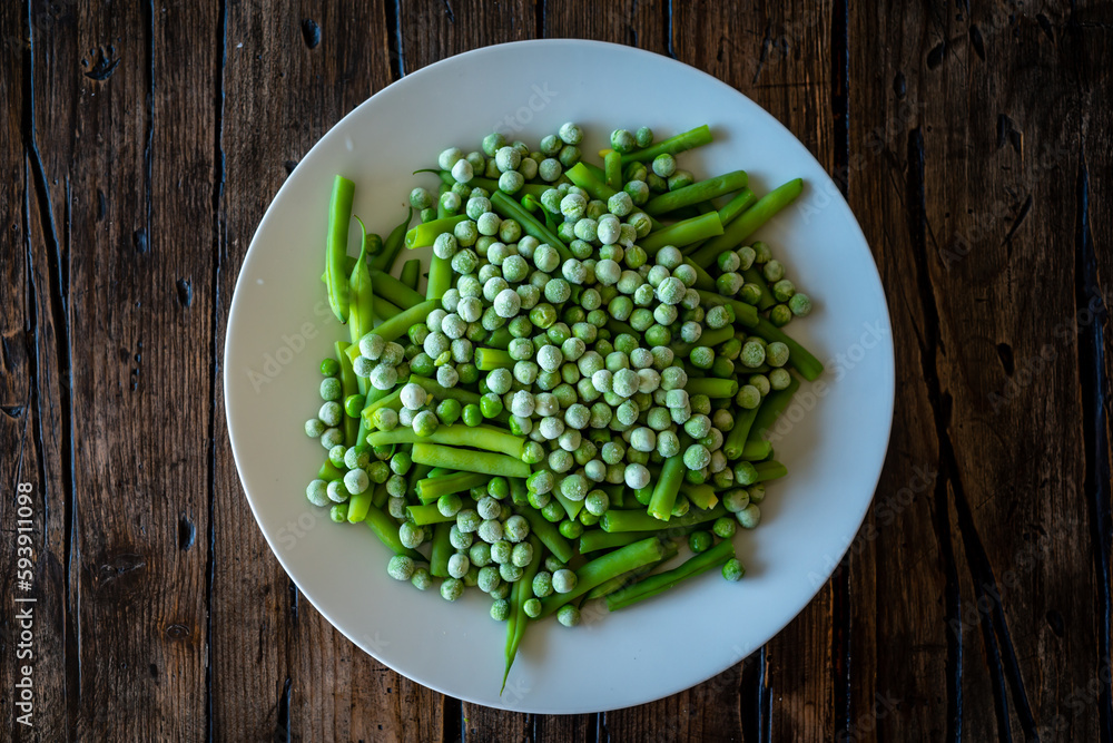 Frozen peas on a plate with greenbeans. Frozen peas on a plate with greenbeans.