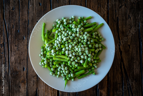 Frozen peas on a plate with greenbeans.