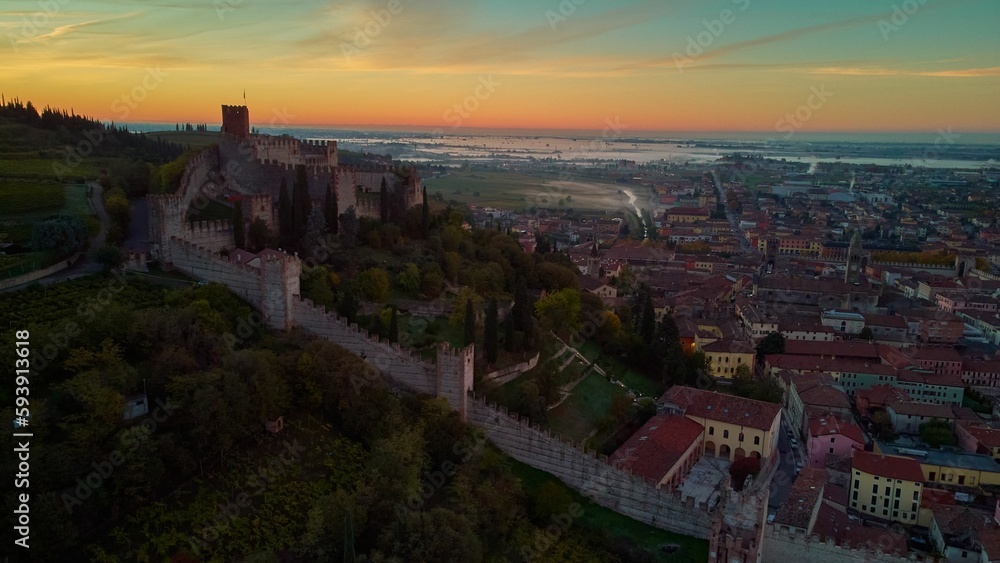 Aerial view of the medieval Soave Castle in Veneto region at sunset, Italy