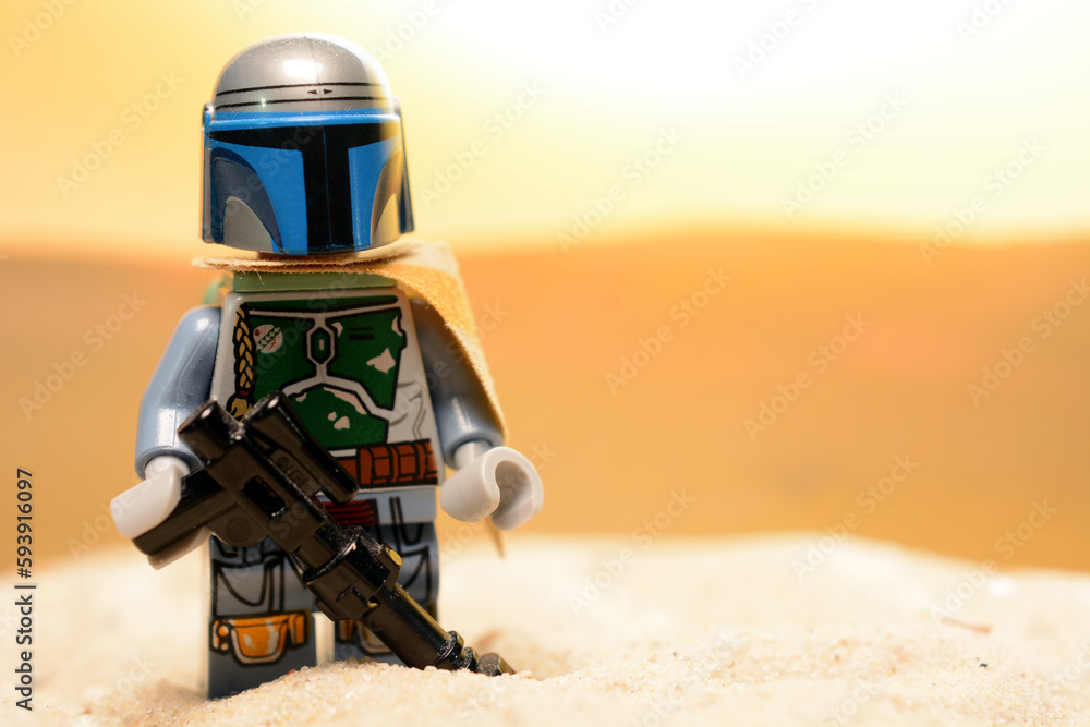 Fototapeta premium Lego Star Wars figure the Mandalorian Din Djarin on the desert planet Tatooine
