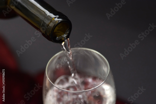 bottle of wine water pouring into glass