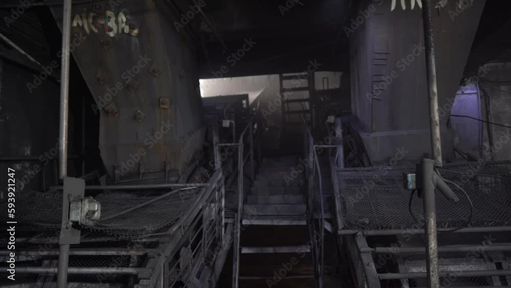 Almaty, Kazakhstan - 04.17.2023 : Conveyor for sifting coal at the heating plant. Almaty, Kazakhstan - 04.17.2023 : Conveyor for sifting coal at the heating plant.