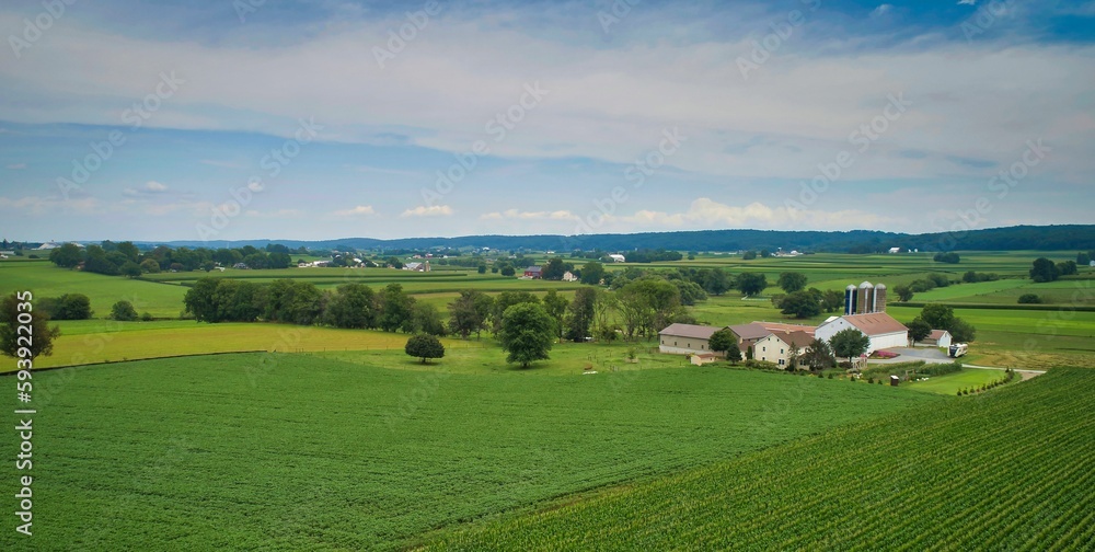 Drone View of Amish Countryside With Barns and Silos, a Patch Work of Corps and Farmlands