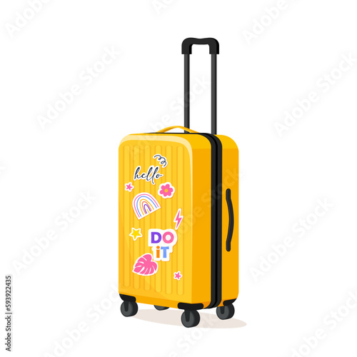 Plastic yellow suitcase with cute stickers isolated on white background.