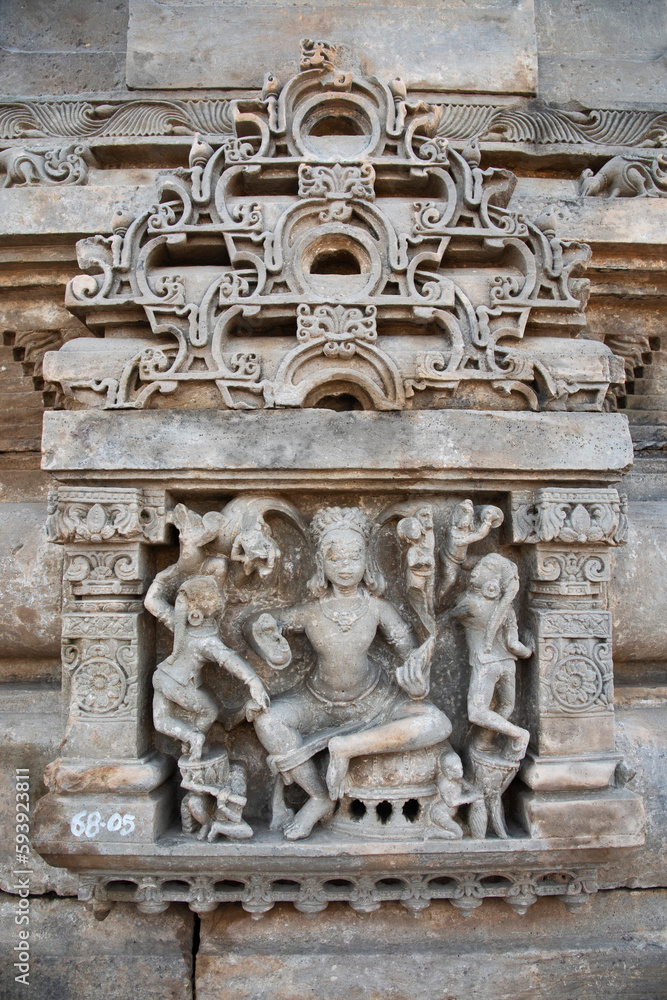Carved stone idols on the outer wall of The Harshat Mata Temple, a Hindu temple dedicated to a goddess Harshat Mata, Abhaneri, Rajasthan, India