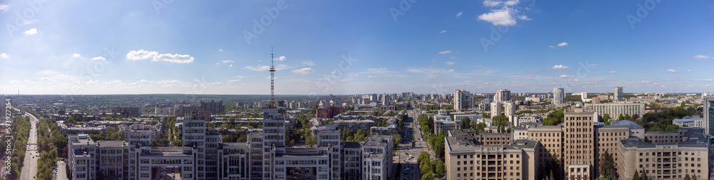Aerial panorama on Derzhprom and northern Karazin National University buildings on Freedom Square on blue sunny sky in Kharkiv, Ukraine