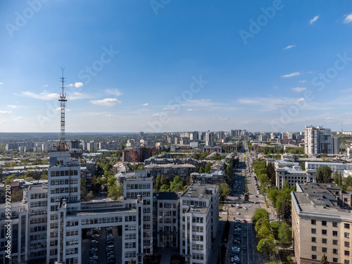 Aerial view on Nauky Ave, street near Derzhprom with cars driving to Freedom Square in spring Kharkiv, Ukraine