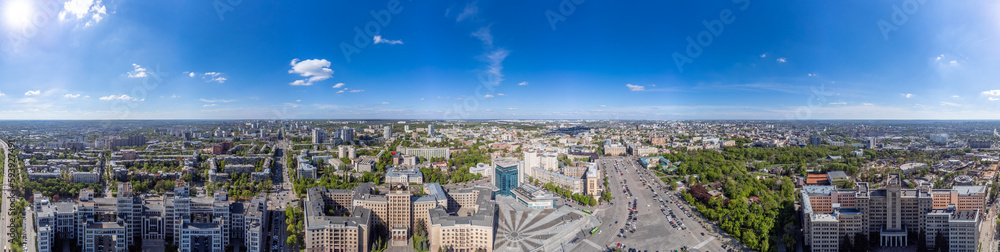 Aerial high panorama view on Derzhprom, Karazin National University buildings and Freedom Square with blue sunny sky in Kharkiv, Ukraine
