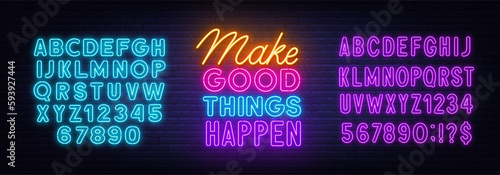 Make Good Things Happen neon quote on brick wall background.