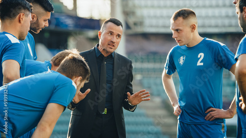 Professional Soccer Team Training  Tactical Coaching  Football Coach Explains Game Strategy  Tactics  Workout Plan to Players. Trainer Motivates Athletes  Leads to Victory  Preparing For Championship