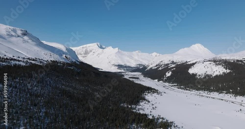 Wallpaper Mural snow covered mountains with moving cars on road in canadian rockies Torontodigital.ca