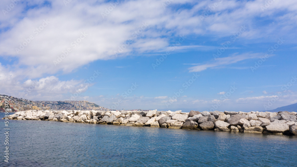 View of Naples waterfront with breakwater.
